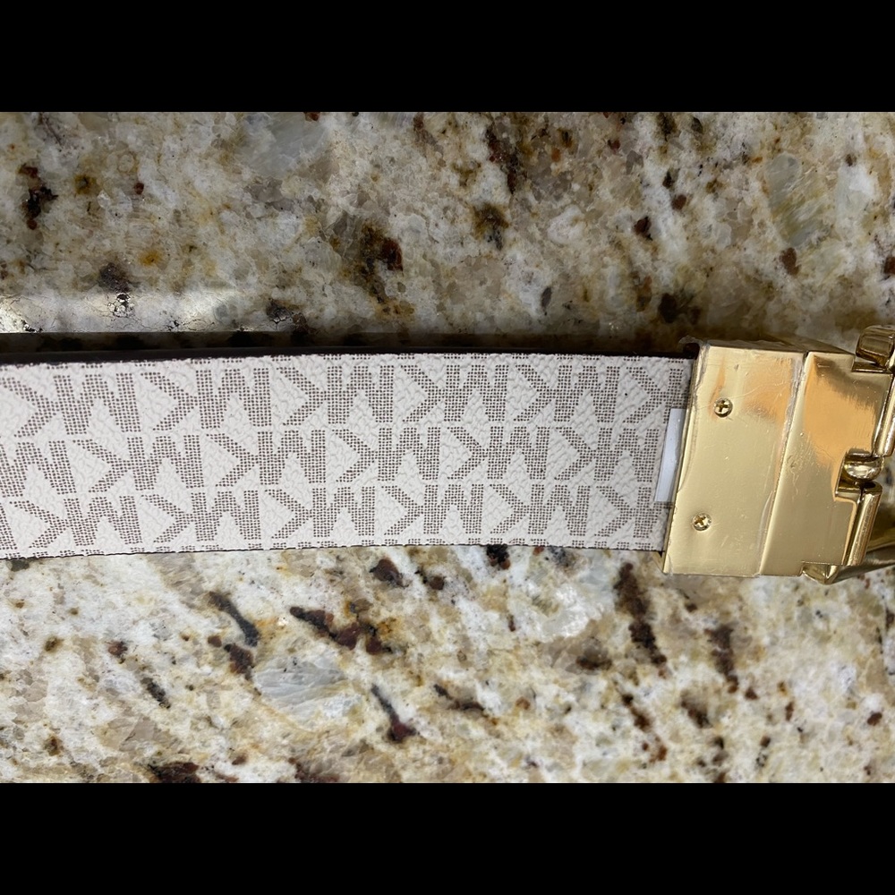 Michael Kors reversible belt. Size S/M worn once. Still has plastic on buckle.